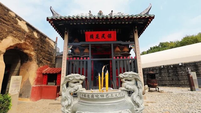 Burning insence sticks at Na Tcha Temple in Macau