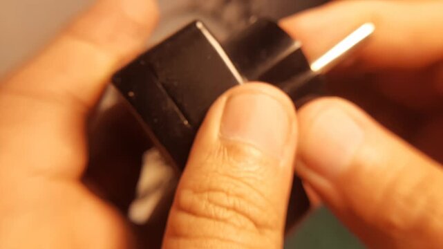 Close Up of Type F Schuko T-Shaped 3-Way Wall Plug Adapter Held in Hand