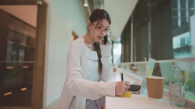 Businesswoman consultant with client talking on smartphone professional work asian business woman finance career confidence work