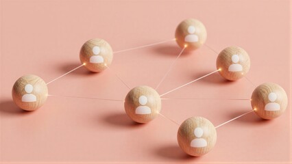 Obraz premium Wooden spheres with person icons connect by glowing lines, symbolizing networked relationships.