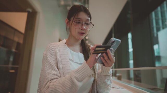 Young adult business asian woman using credit card shopping online or banking payment, digital wallet paying