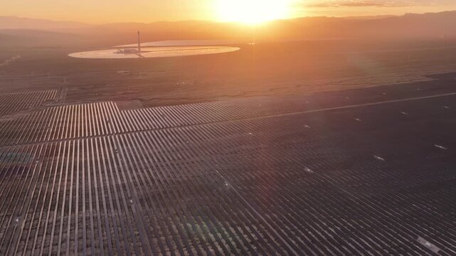 Majestic Sunset Silhouette of Concentrated Solar Power Tower Plant in Desert of Qinghai, Northwest China