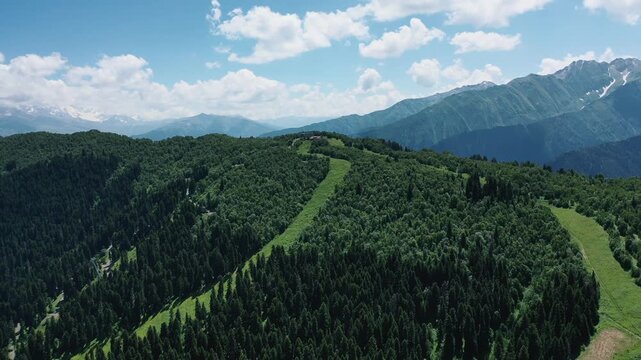 Hatsvali ski resort summer aerial forested slopes, Mestia Svaneti Georgia, supporting mountain tourism, hiking, cable car travel and four-season recreation.