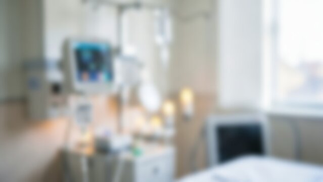 Blurred modern hospital room with patient monitor for medical website