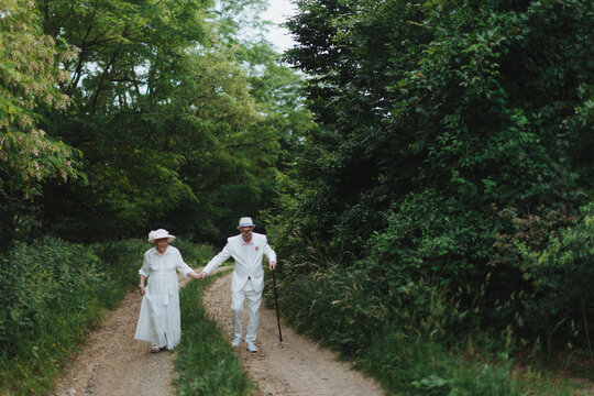 Senior couple having marriage in garden, during summer day.