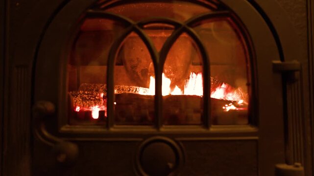 Wood Burning Inside a Traditional Cast Iron Stove Hearth