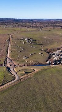 Aerial View of Winding Dirt Road Through Rural Australian Landscape
