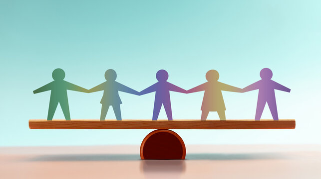 Paper people hold hands while balanced on a wooden beam,equality, unity, cooperation