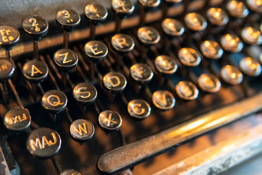Close-up of black circular keys on a vintage retro typewriter