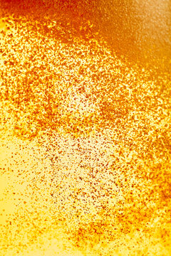 Macro view of golden carbonated beer bubbles texture