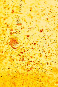 Abstract Golden Amber Liquid Resin Texture Background