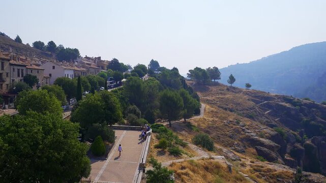 Elevated view of historic houses gardens and walking paths near the Cuenca old town