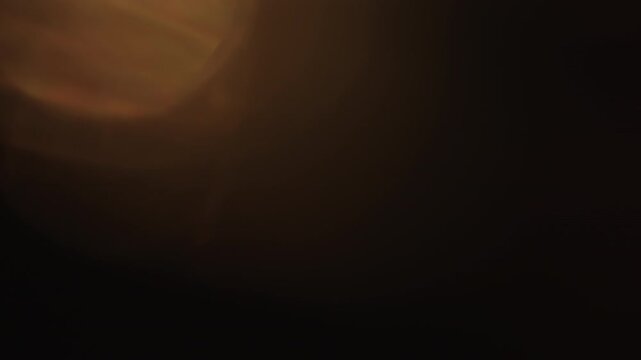 Slow motion real lens flare from back sunlight over dark background for overlay