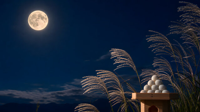 Traditional Japanese tsukimi autumn moon viewing night scene with a bright full harvest moon, silvery susuki pampas grass swaying in the wind and a stack of white rice dumplings on a wooden offering s