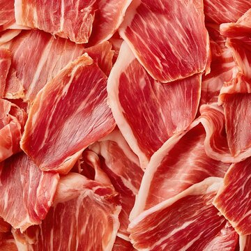 Thinly sliced cured ham with marbled fat and red meat texture
