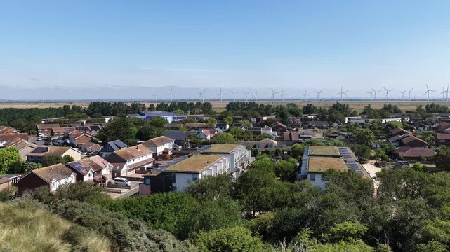 Aerial view of Camber Sands village in England during a sunny summer afternoon