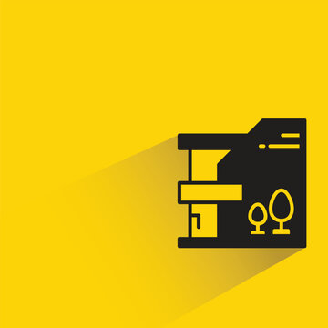 modern house building with shadow on yellow background