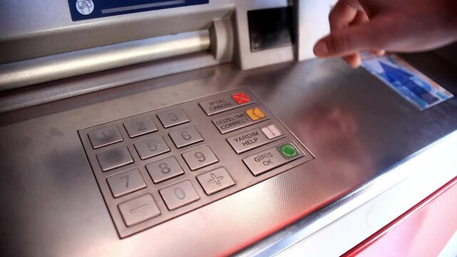 ATM machine inside modern bank terminal building with digital electronic screen display for secure financial transactions in 4K Ultra HD footage
