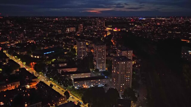 Aerial drone footage of the residential neighbourhood surrounding Arsenal FC's Emirates Stadium in North London, England. The video captures rows of traditional terraced houses.