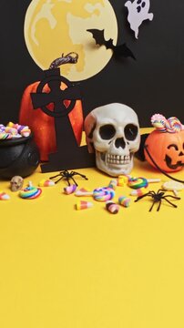 Spooky halloween party decorations with candy and pumpkins