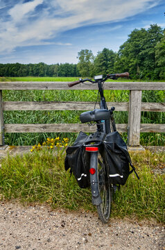 E bike parked on gravel path enjoying a summer break during a long distance cycling tour in rural germany