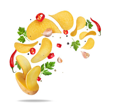 Potato chips floating in the air with dill and red chili pepper isolated on transparent background