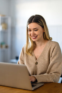 Technology remote job, lifestyle concept. Success woman with laptop computer working at home office