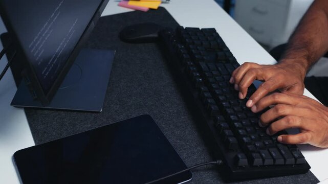 Software Developer Hands on Computer Keyboard with Coding Interface on Screen, Working on Programming Task and AI Model in Office at Night.
