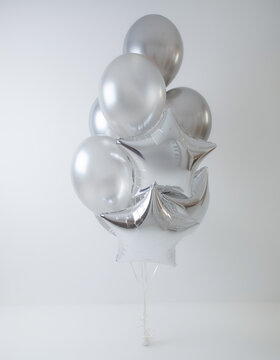 a bunch of beautiful 3d silver balloons 