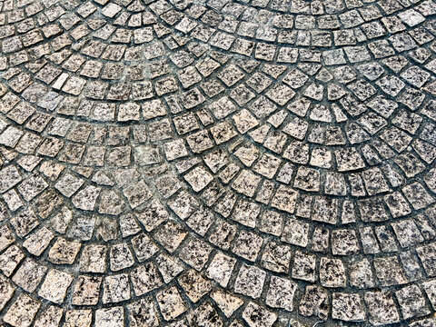Fan shaped cobblestone pavement texture pattern high angle view