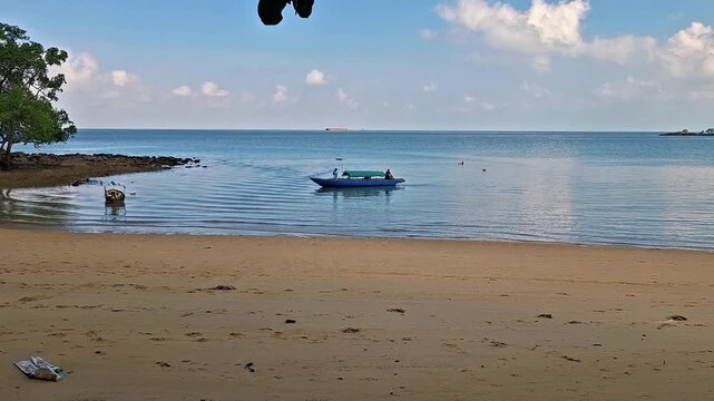 A fisherman's boat heading towards the shore.