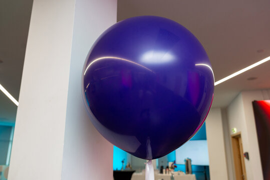 Single purple balloon at event venue
