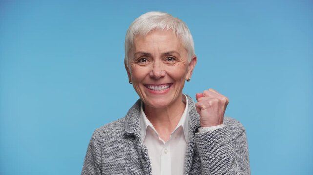 Joyful Senior Woman Celebrating Success With Confidence