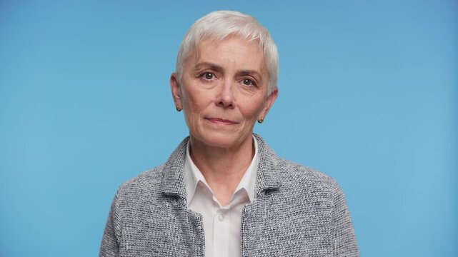 Senior Woman Shaking Head in Disapproval