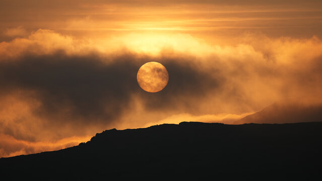 Sundown in the Scottish Highlands with fog rolling in of the sea