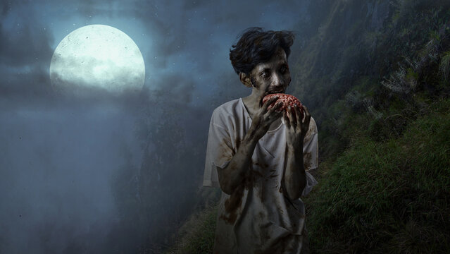 A spooky, cinematic scene featuring a zombie-like man eating a human brain under the eerie glow of a full moon in a misty, dark landscape, perfect for Halloween horror themes. Concept of Halloween