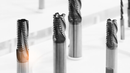 various types drill bits milling cutter. display organized and bits arranged  tech industrial technology background © Aleksandr Matveev