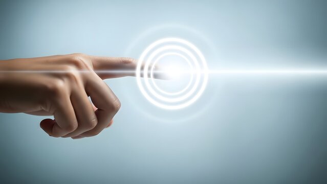 Close up human finger touching glowing light circle interface on plain background for abstract tech concept.