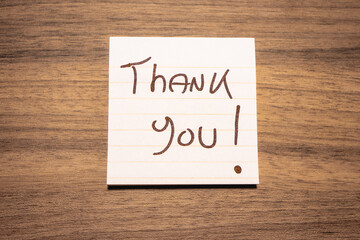 A handwritten note with the text Thank You  on it. © Sonny
