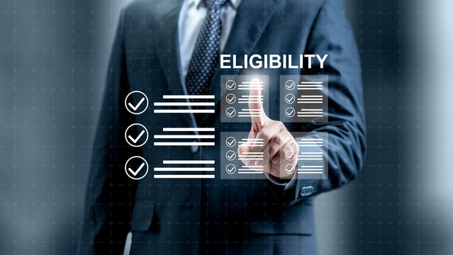Businessman pointing at a virtual screen with the word 'Eligibility' and checkmark lists, representing compliance, verification, and qualification processes. Concept of Eligibility