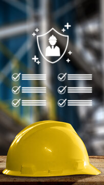 Yellow safety helmet on wood with industrial background and digital safety checklist overlay. Occupational safety concept