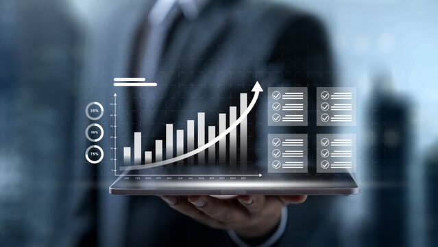 Businessman holding a tablet displaying a holographic growth chart and checklist icons, representing business success and data analysis. Concept of business growth or finance