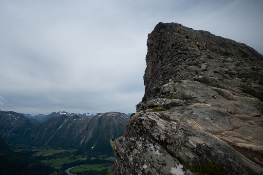 Romsdalseggen Ridge Hikers Climbing Steep Rocky Summit, M&oslash;re og Romsdal, Norway