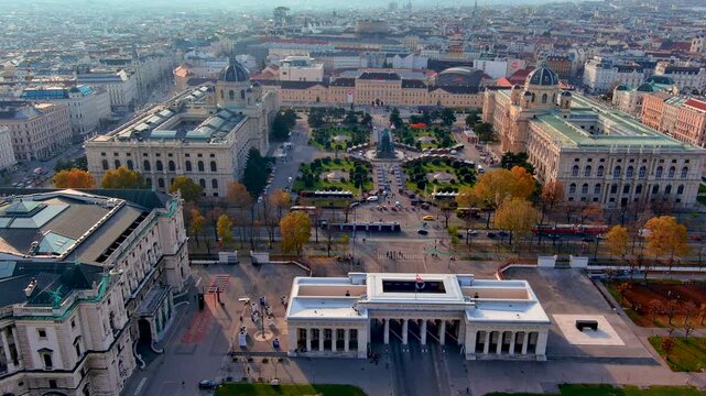 Aerial drone view of the Outer Burgtor gate on Heldenplatz at the Hofburg palace with the Ringstrasse, Maria Theresien Platz museums and MuseumsQuartier, Vienna, Austria, in autumn.