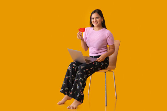 young woman sitting on a chair with laptop