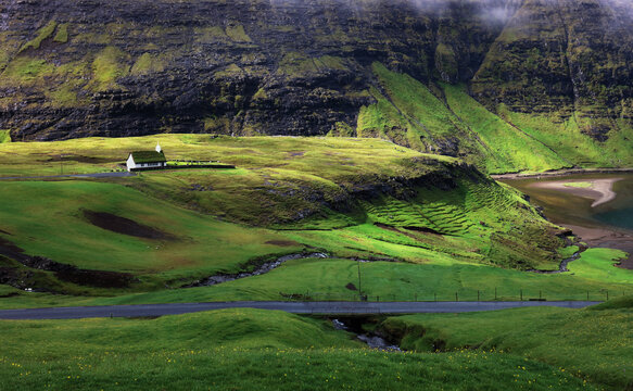 Faroe islands - Grass roof houses in the small village Saksun, Dark clouds atmosphere