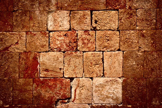 A texture of stone wall of ancient Mayan ruins in Mexico