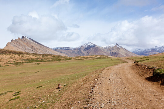 Scene featuring road in mountains (Himalayas). Spiti Valley, Himachal Pradesh, India