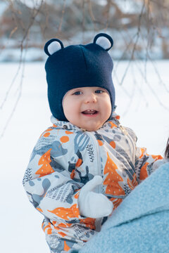 Happy baby in winter attire outdoors Portrait