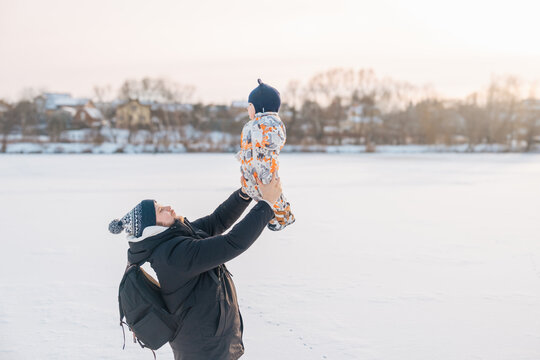 Father and Baby Bonding in Winter Wonderland.